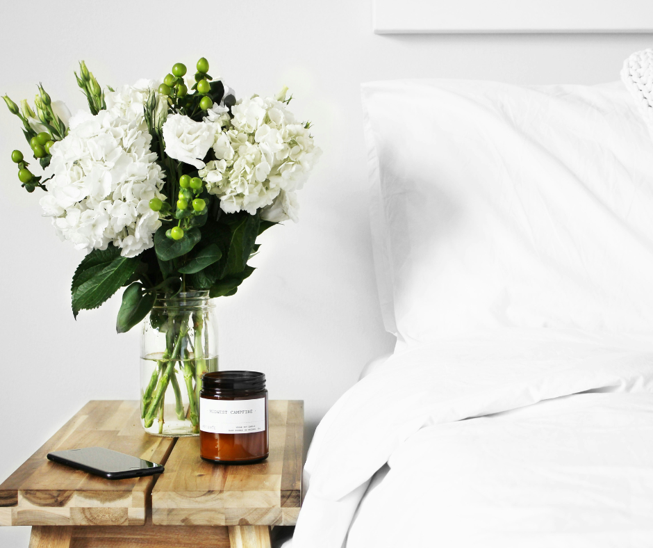 Comfy nightstand with phone and candle